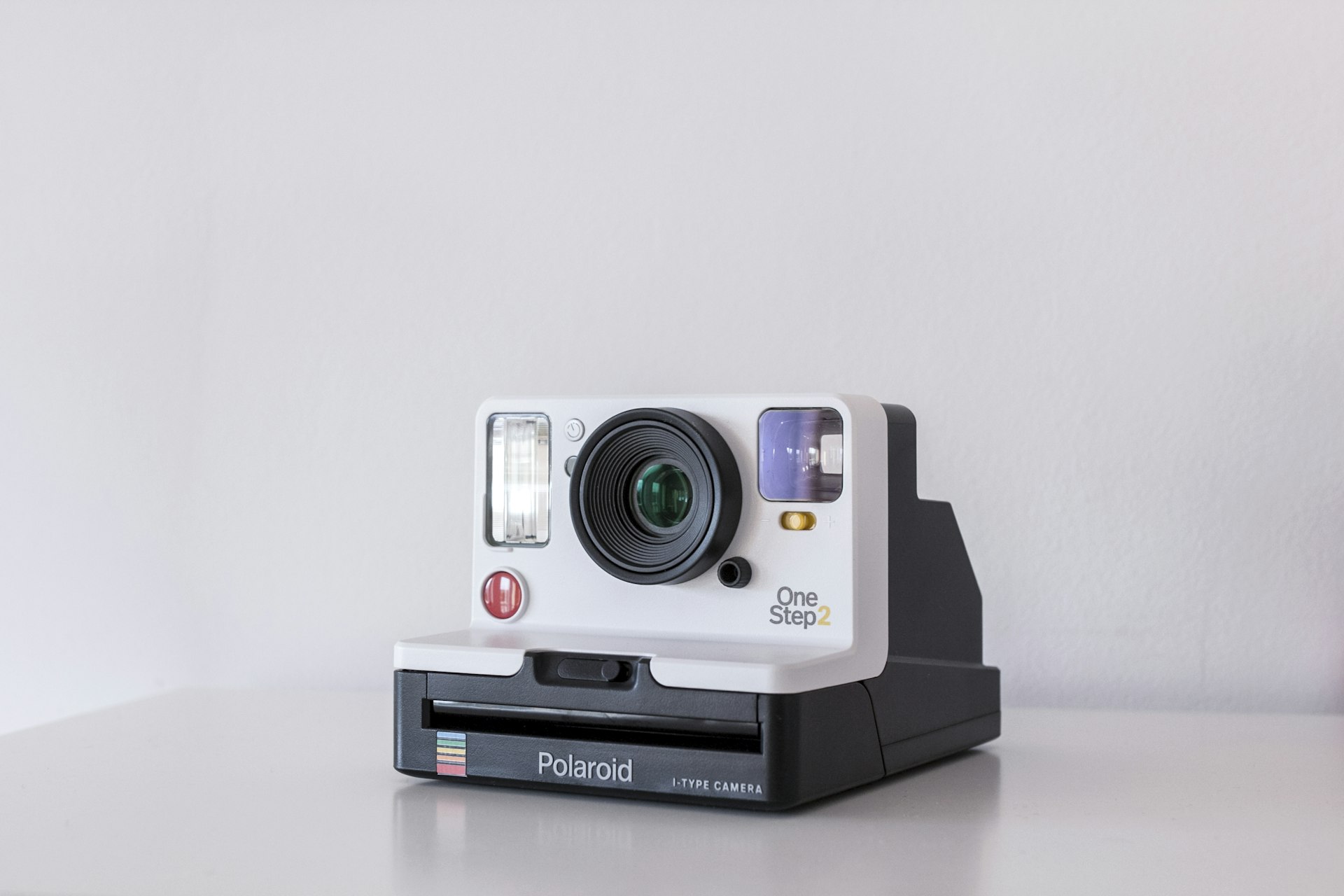 Product photography flat-lay desk with digital camera and studio lighting